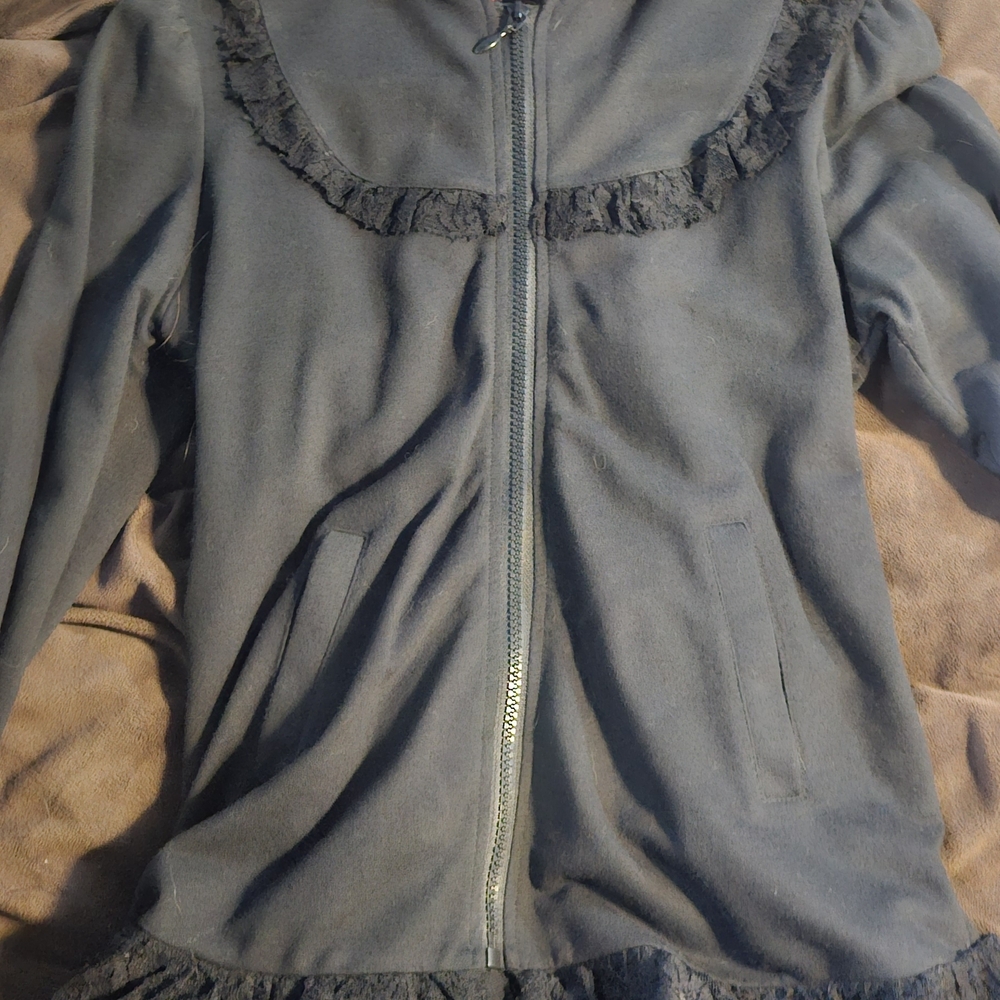 Elegant Black Teddy Jacket with Ruffle Trim